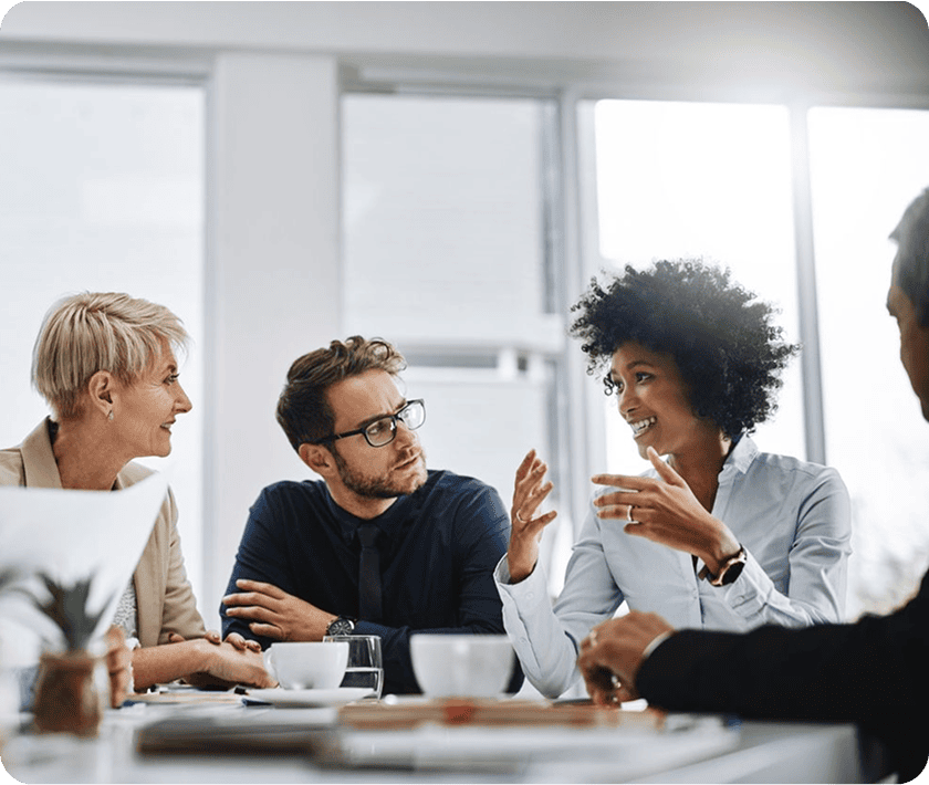 Colleagues collaborating around conference table